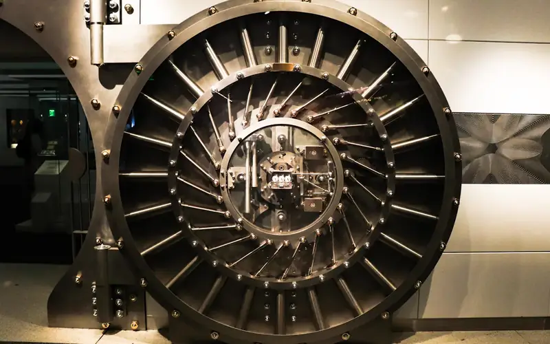 The round steel door of a bank vault