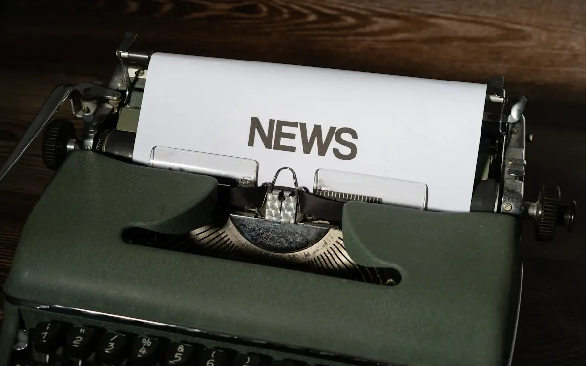 A typewriter with the word NEWS on the page