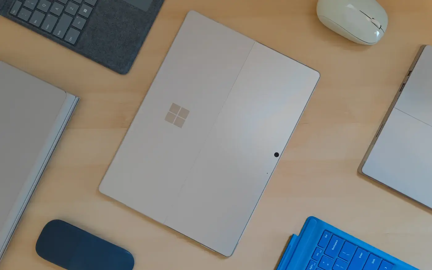 A laptop and accessories laid out on a desk